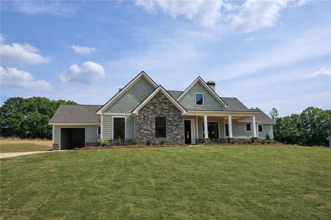 Front exterior of a new home in , Statham, GA, highlighting curb appeal (Image 2).