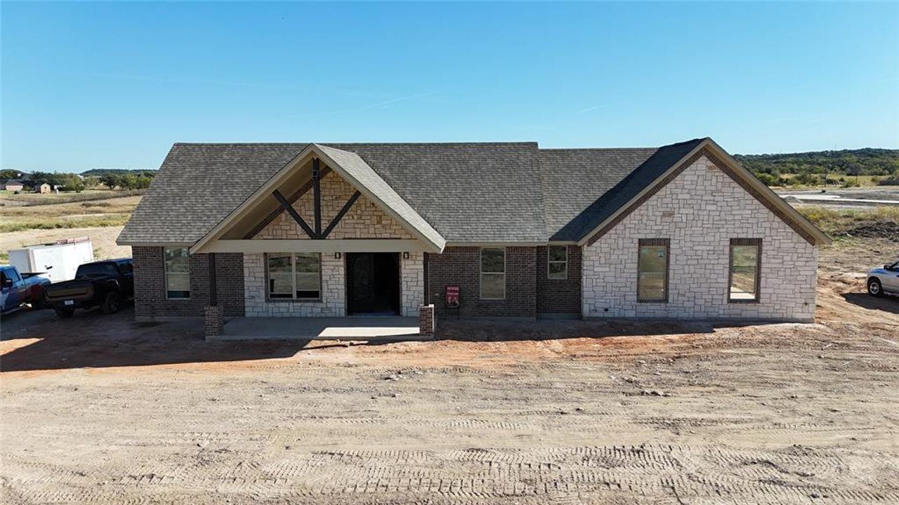 Front exterior of a new home in , Nemo, TX, highlighting curb appeal (Image 2).
