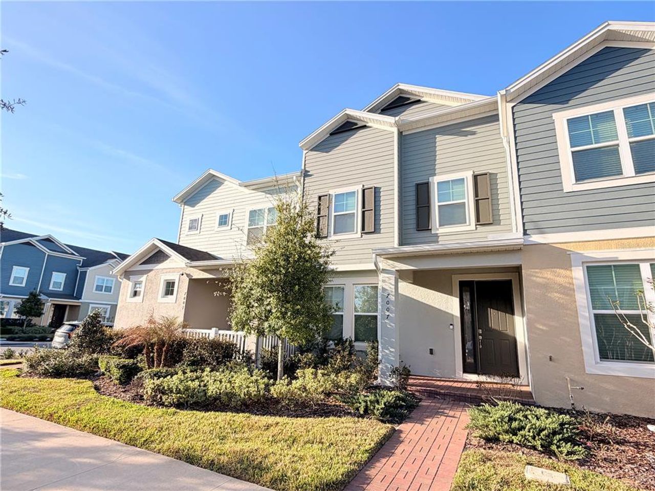 Front exterior of a new home in , Winter Garden, FL, highlighting curb appeal (Image 2).