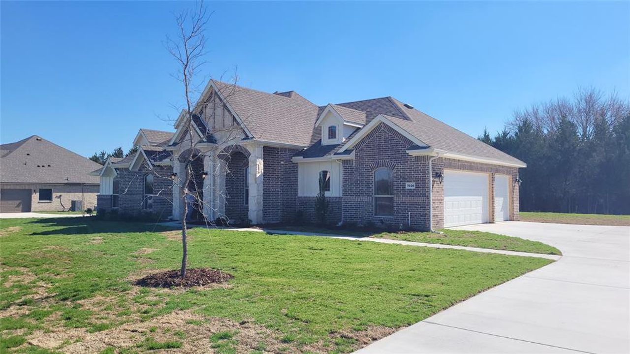 Front exterior of a new home in Sagebrush Addition, Midlothian, TX, highlighting curb appeal (Image 2). Front exterior of a new home in Sagebrush Addition, Midlothian, TX, highlighting curb appeal (Image 2).