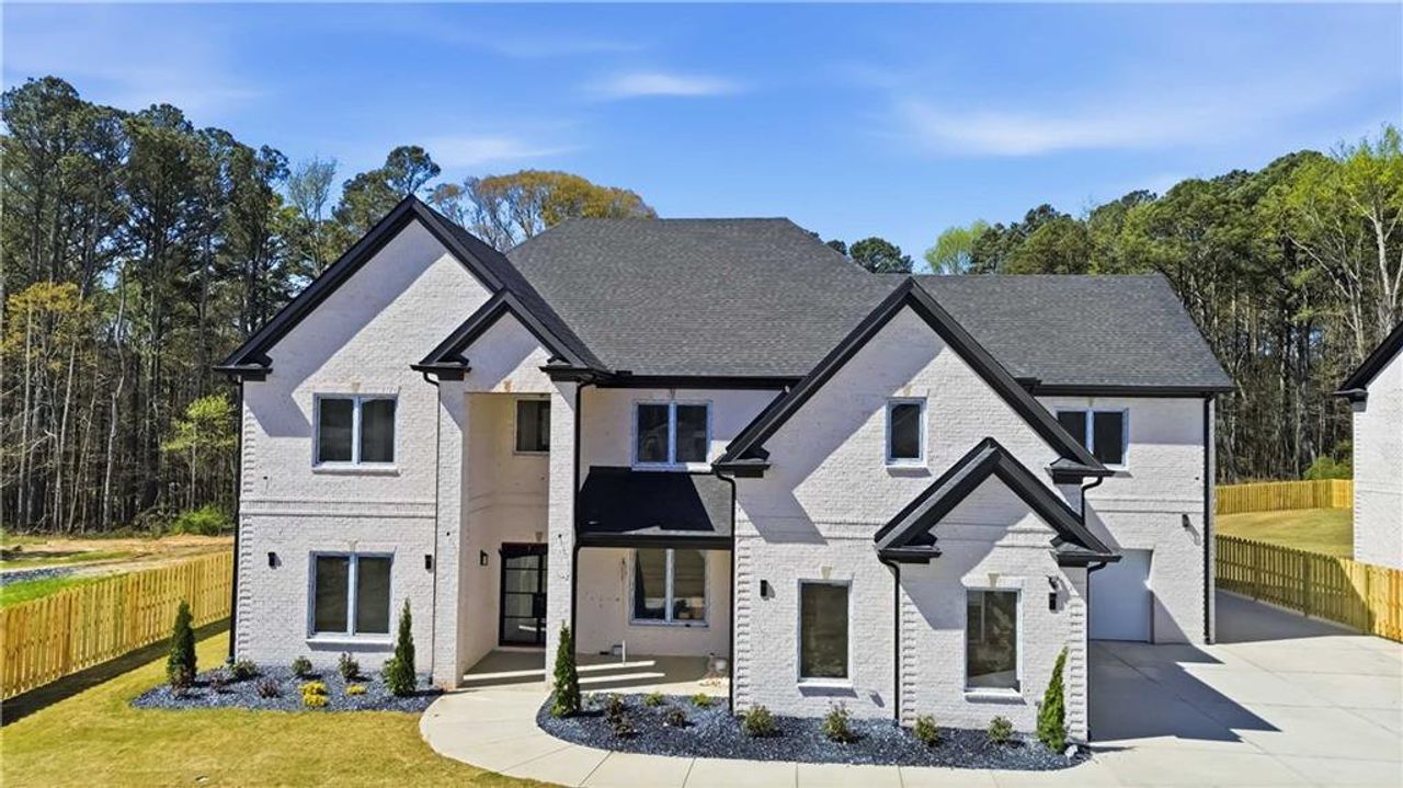 Front exterior of a new home in , Lawrenceville, GA, highlighting curb appeal (Image 2).