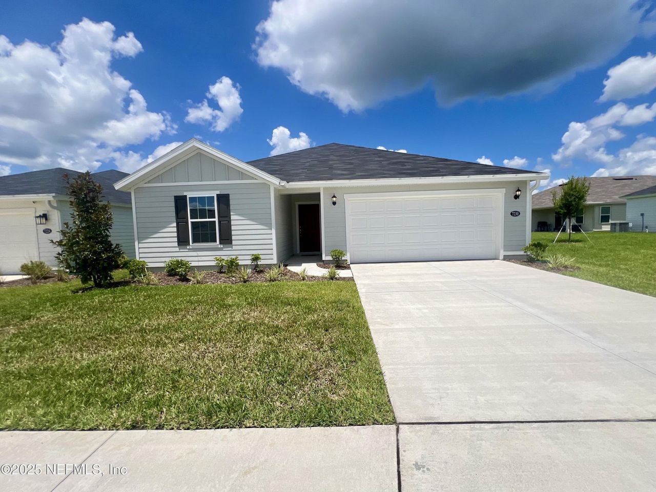 Front exterior of a new home in Hawkes Meadow, Jacksonville, FL, highlighting curb appeal (Image 2).