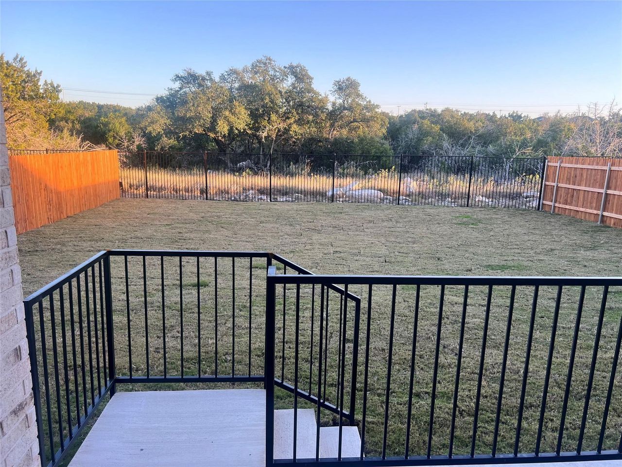 Exterior details and patio area of a home in Thunder Rock, Marble Falls (Image 2).