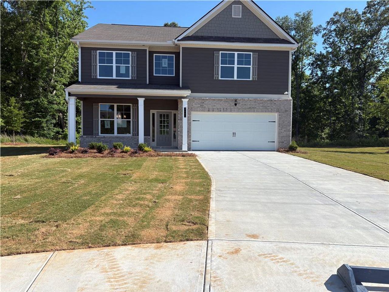 Front exterior of a new home in Highland Park, Stonecrest, GA, highlighting curb appeal (Image 2). Front exterior of a new home in Highland Park, Stonecrest, GA, highlighting curb appeal (Image 2).