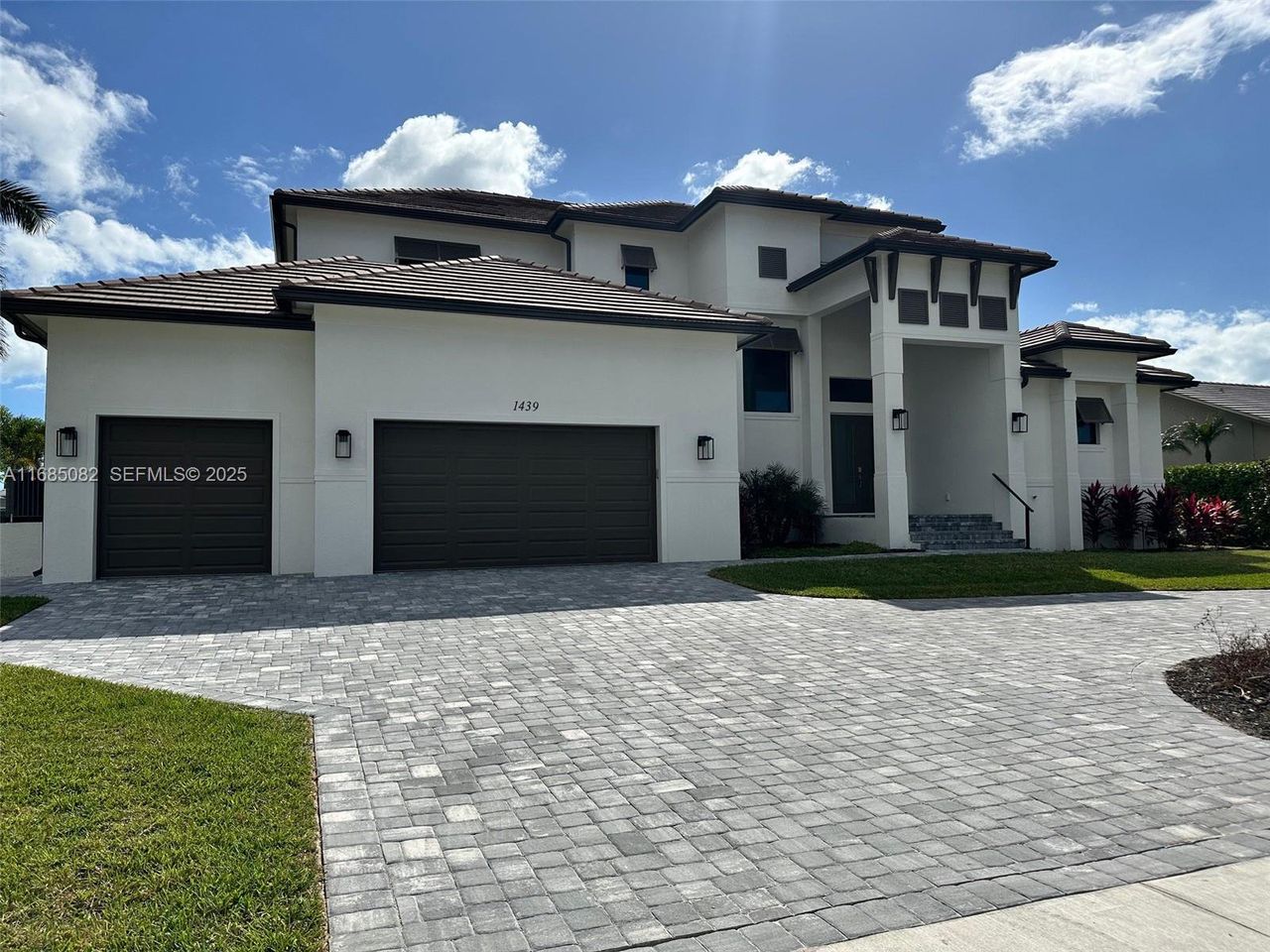 Front exterior of a new home in , Marco Island, FL, highlighting curb appeal (Image 2). Front exterior of a new home in , Marco Island, FL, highlighting curb appeal (Image 2).