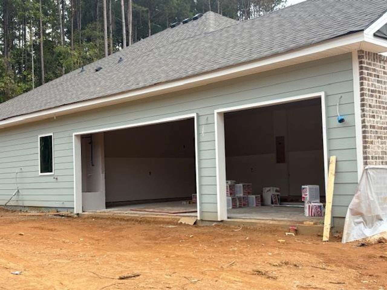Front exterior of a new home in Eagle Heights, Maysville, GA, highlighting curb appeal (Image 2).