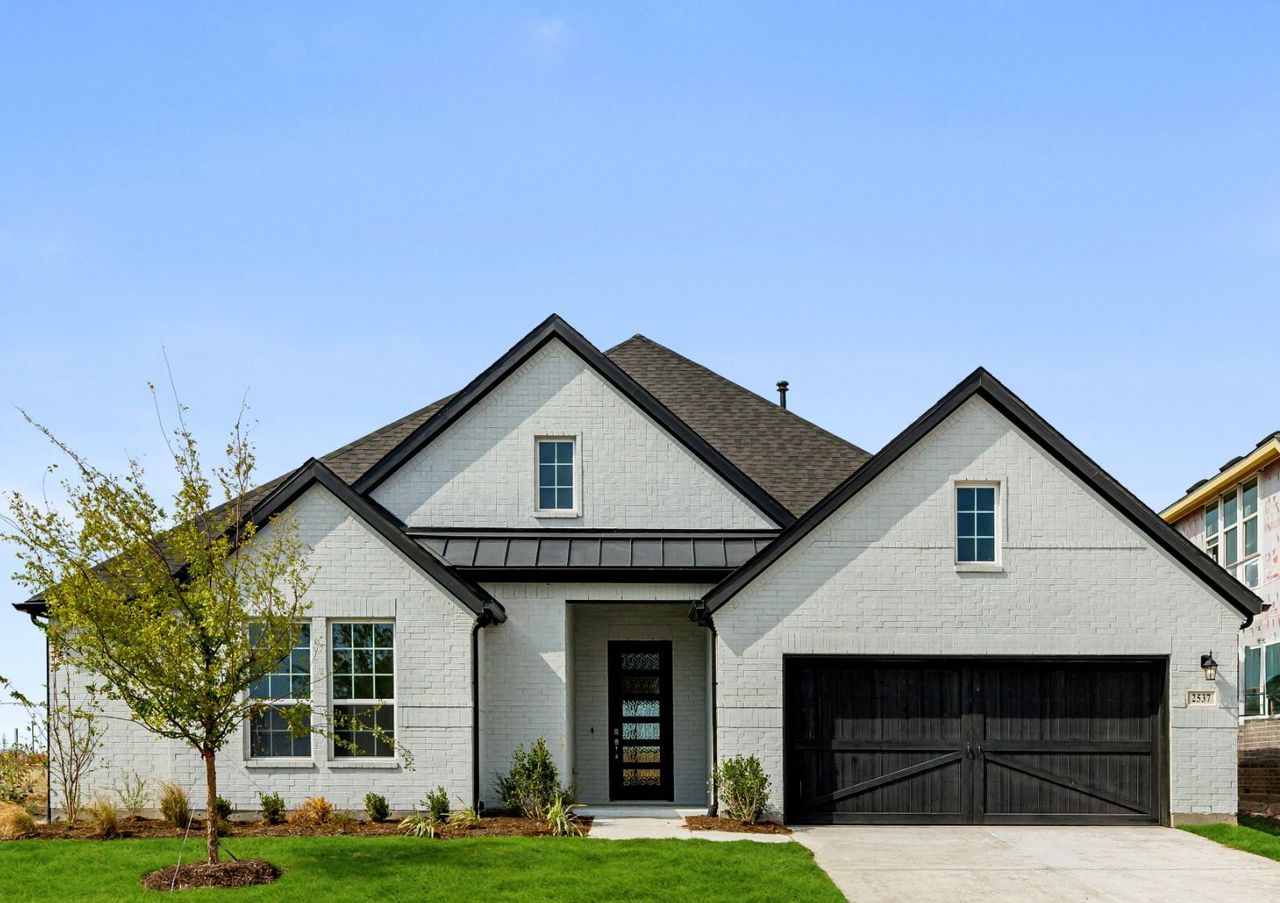 Representative exterior photo of a completed home built from the Mason by UnionMain Homes in Myrtle Creek, Waxahachie, TX (Image 2). Representative exterior photo of a completed home built from the Mason by UnionMain Homes in Myrtle Creek, Waxahachie, TX (Image 2).