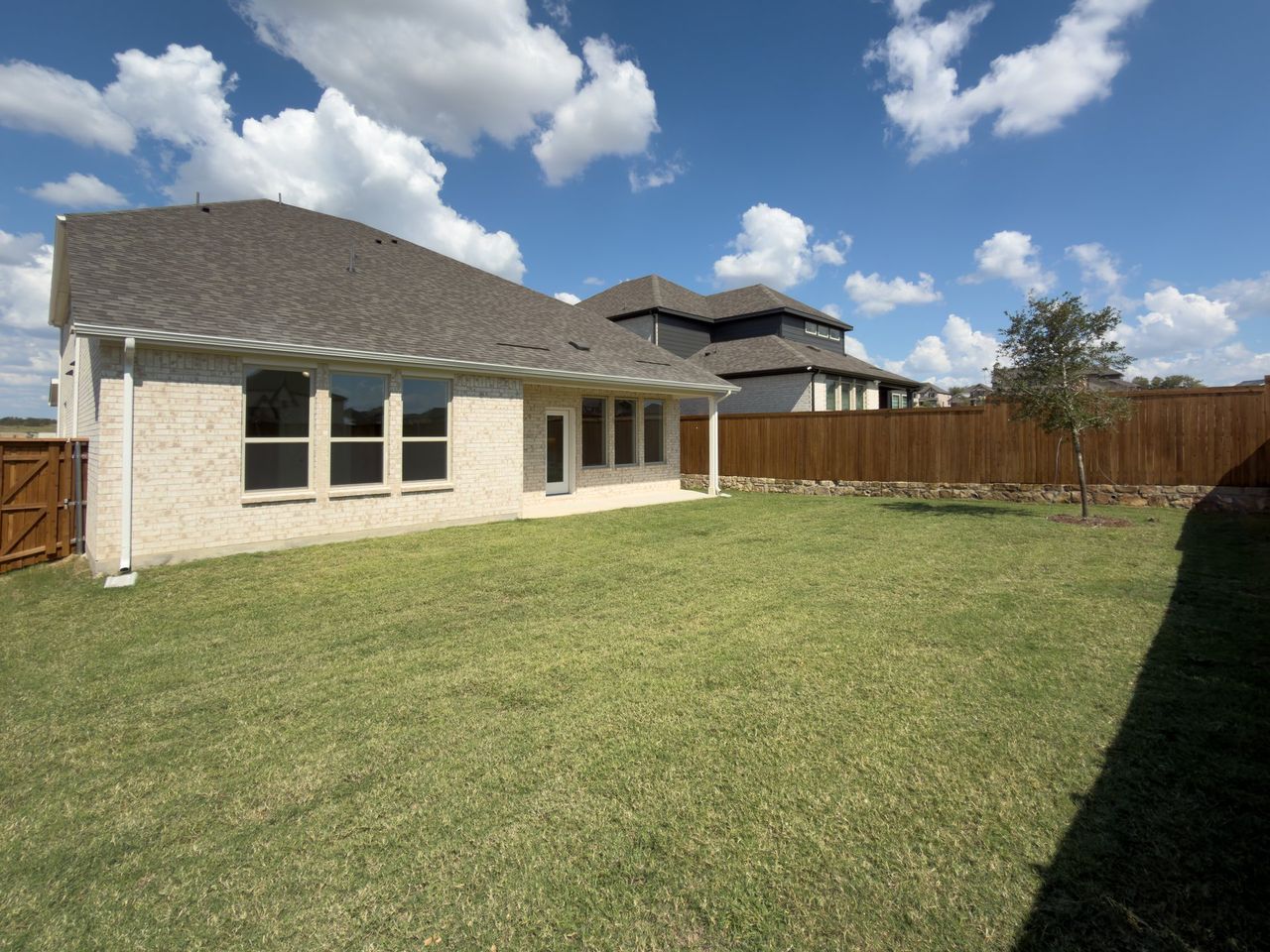 Exterior details and patio area of a home in Enclave at Legacy Hills: Crossings 50', Celina (Image 2).