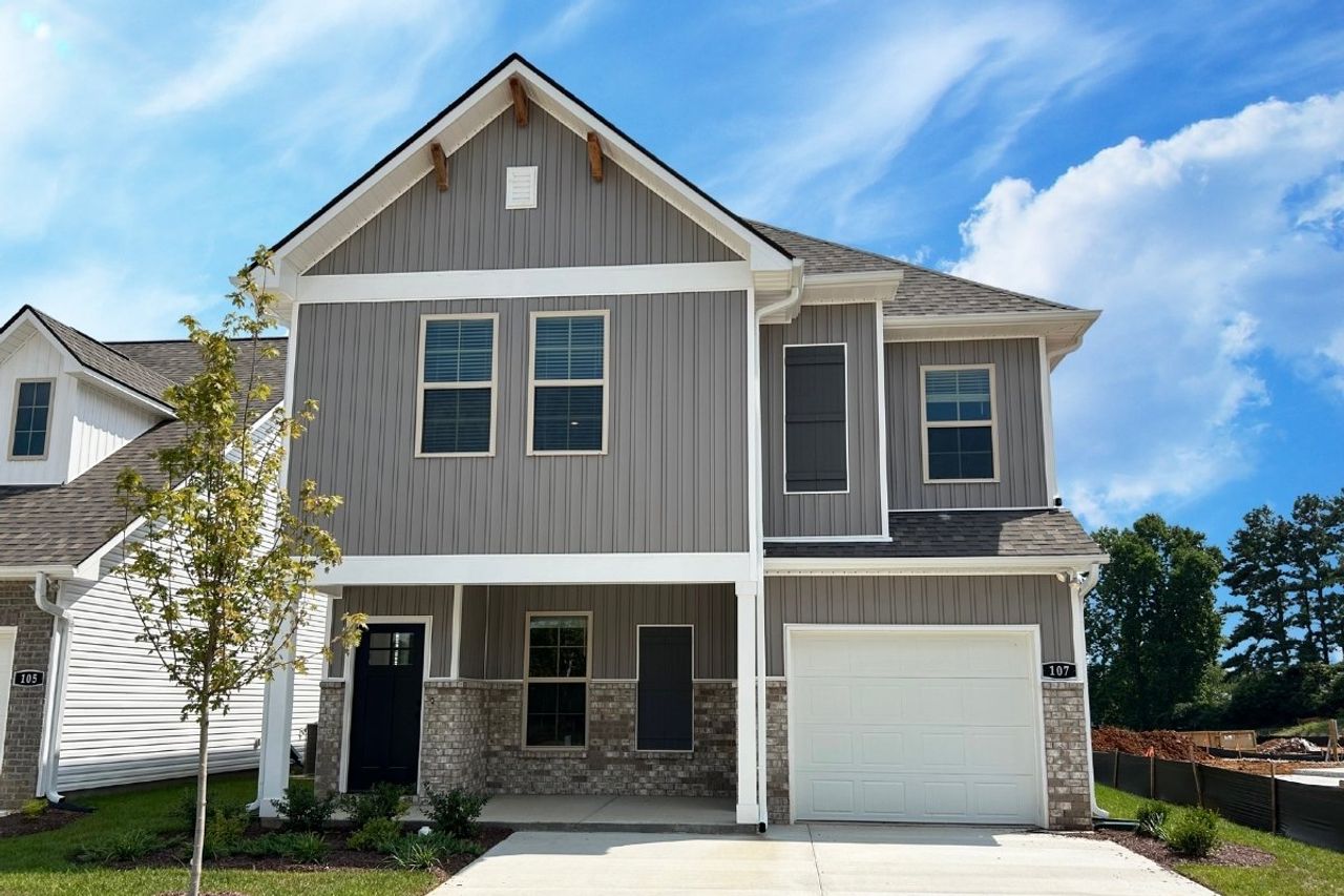 Front exterior of a new home in Hickory Cove, Burns, TN, highlighting curb appeal (Image 2).