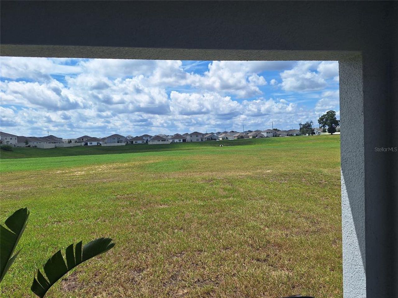 Exterior details and patio area of a home in Ocala Crossings South, Ocala (Image 2).
