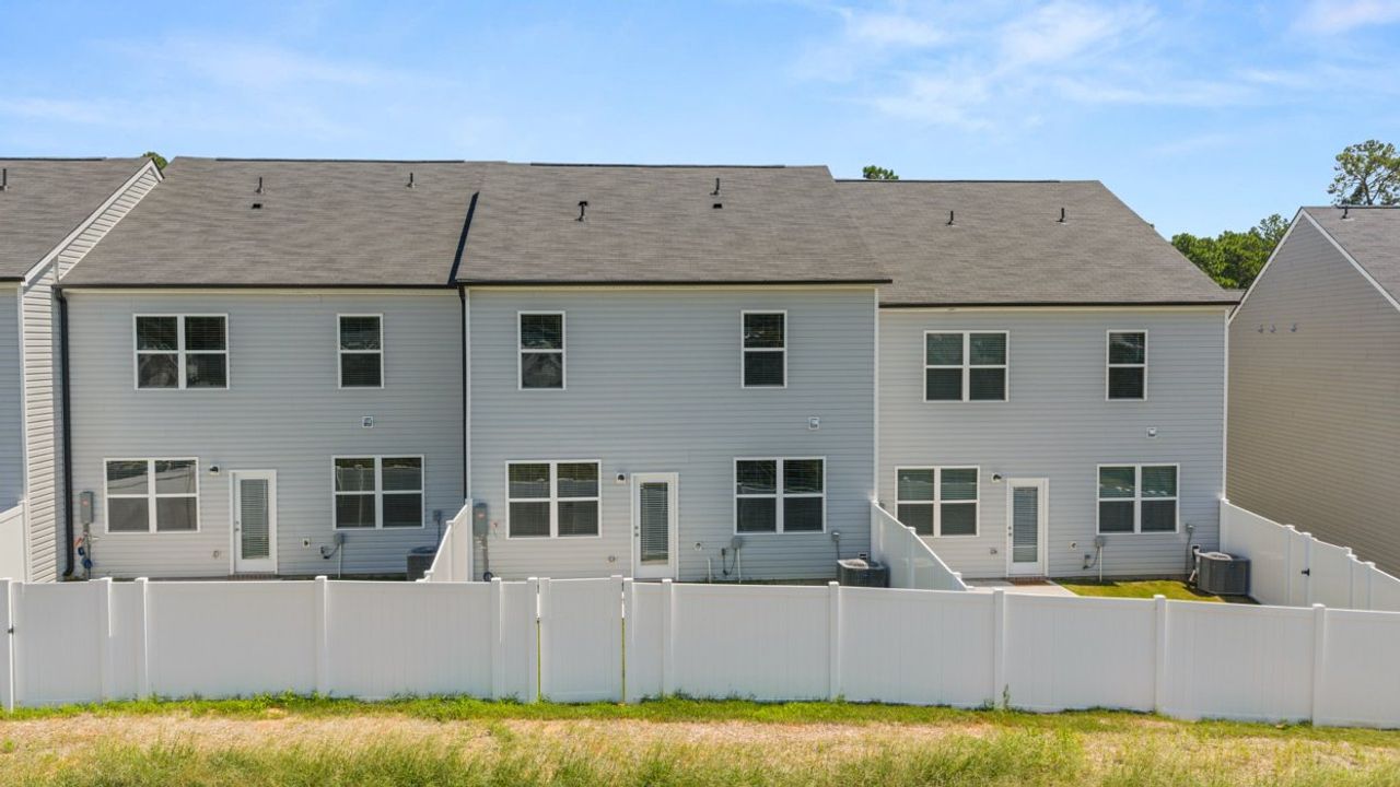 Exterior details and patio area of a home in Rushing Waters Townhomes, North Augusta (Image 2). Exterior details and patio area of a home in Rushing Waters Townhomes, North Augusta (Image 2).
