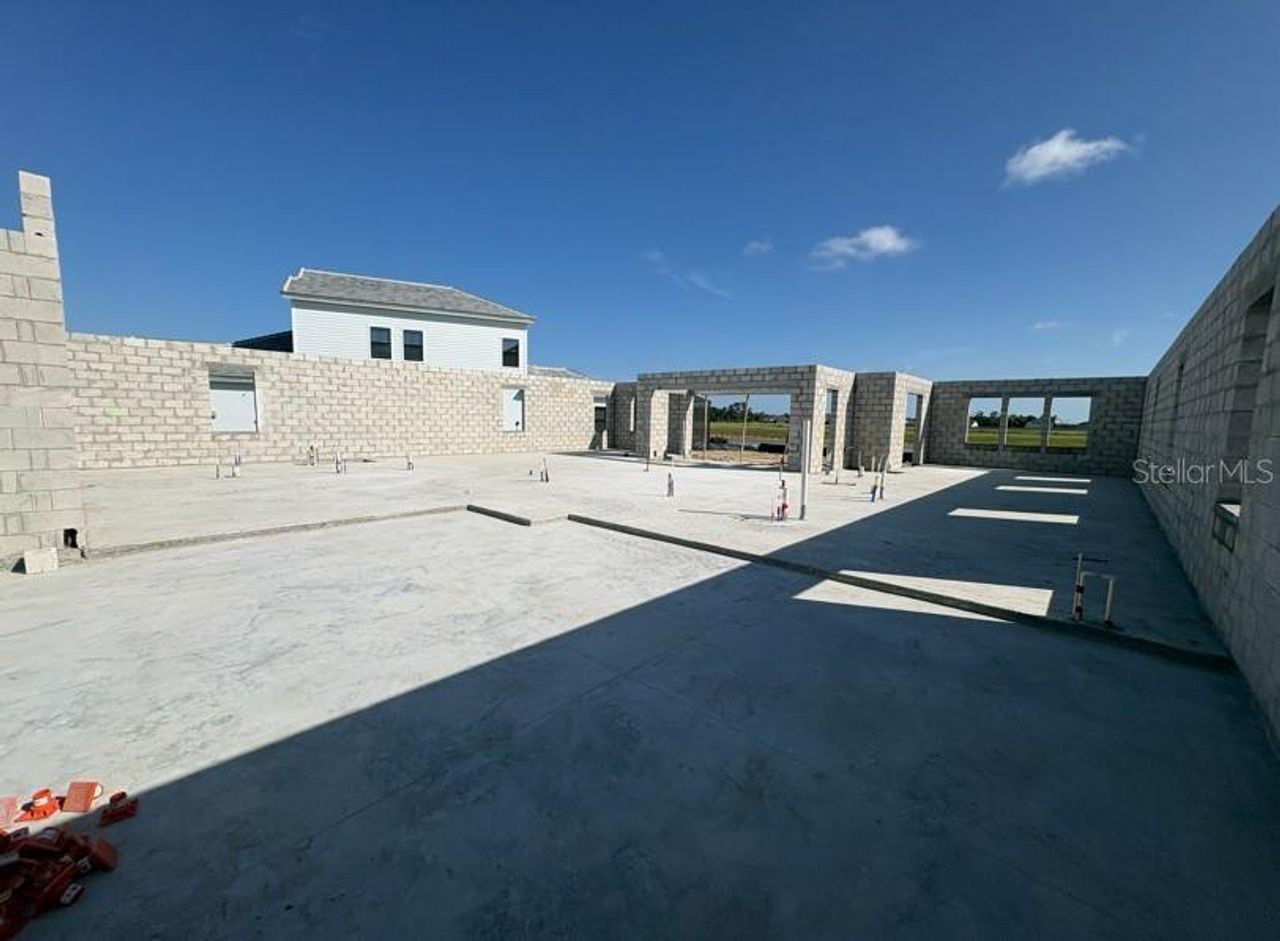 Exterior details and patio area of a home in Oakfield, Parrish (Image 2).