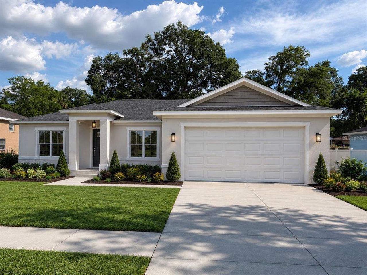 Front exterior of a new home in , Summerfield, FL, highlighting curb appeal (Image 2). Front exterior of a new home in , Summerfield, FL, highlighting curb appeal (Image 2).