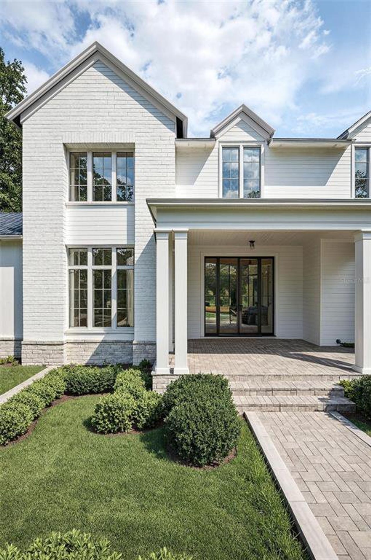 Front exterior of a new home in Briley Farm, Oakland, FL, highlighting curb appeal (Image 2). Front exterior of a new home in Briley Farm, Oakland, FL, highlighting curb appeal (Image 2).