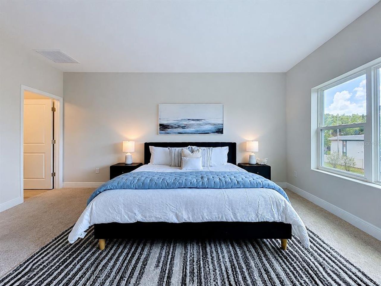 Furnished interior view inside a new home in The Towns At Long Bayou, Seminole (Image 2). Furnished interior view inside a new home in The Towns At Long Bayou, Seminole (Image 2).