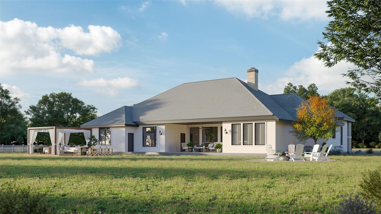 A generous lawn extends from this residence, featuring a covered patio for outdoor gatherings. A generous lawn extends from this residence, featuring a covered patio for outdoor gatherings.