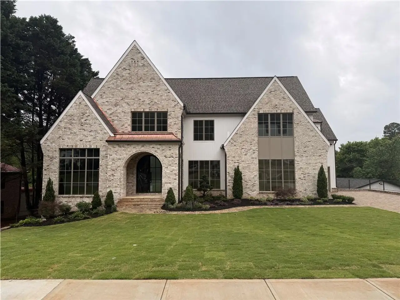 Front exterior of a new home in , Roswell, GA, highlighting curb appeal (Image 2).