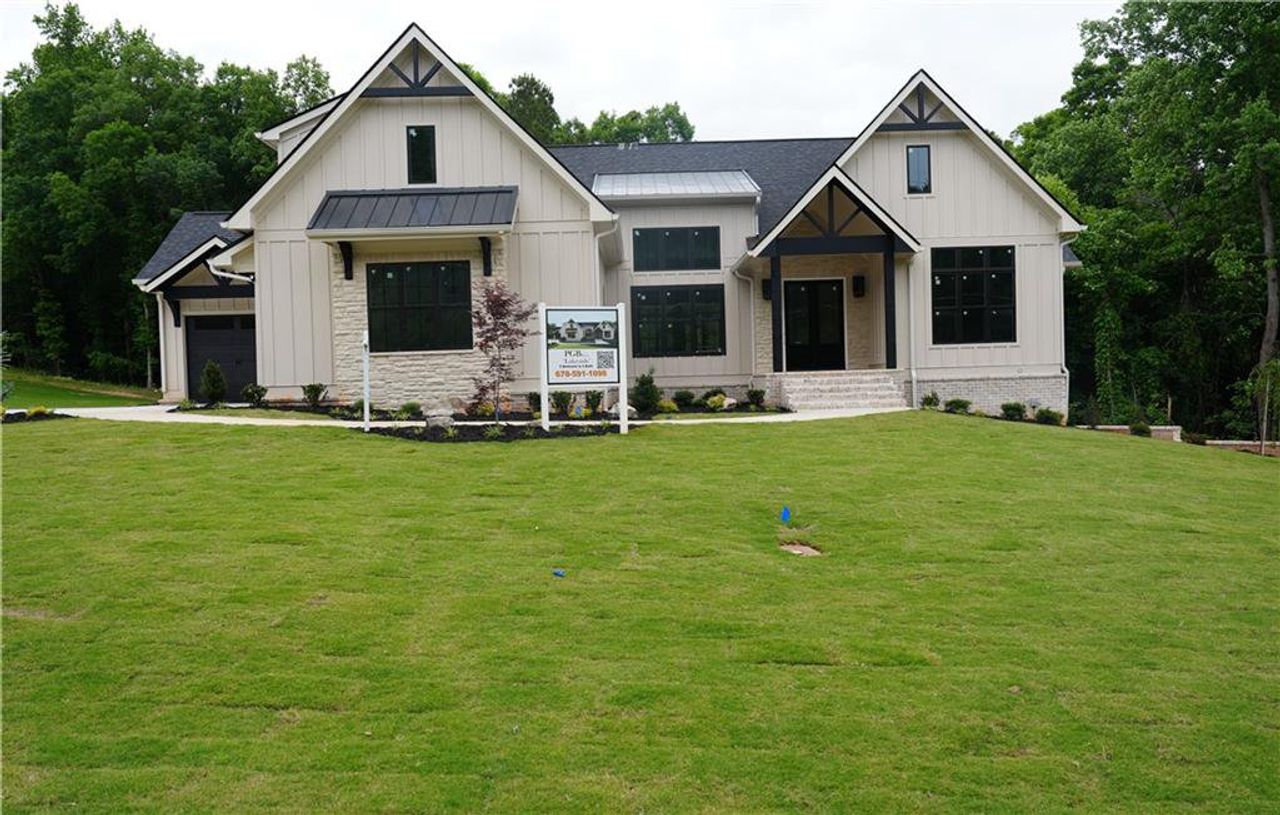 Front exterior of a new home in , Conyers, GA, highlighting curb appeal (Image 2). Front exterior of a new home in , Conyers, GA, highlighting curb appeal (Image 2).