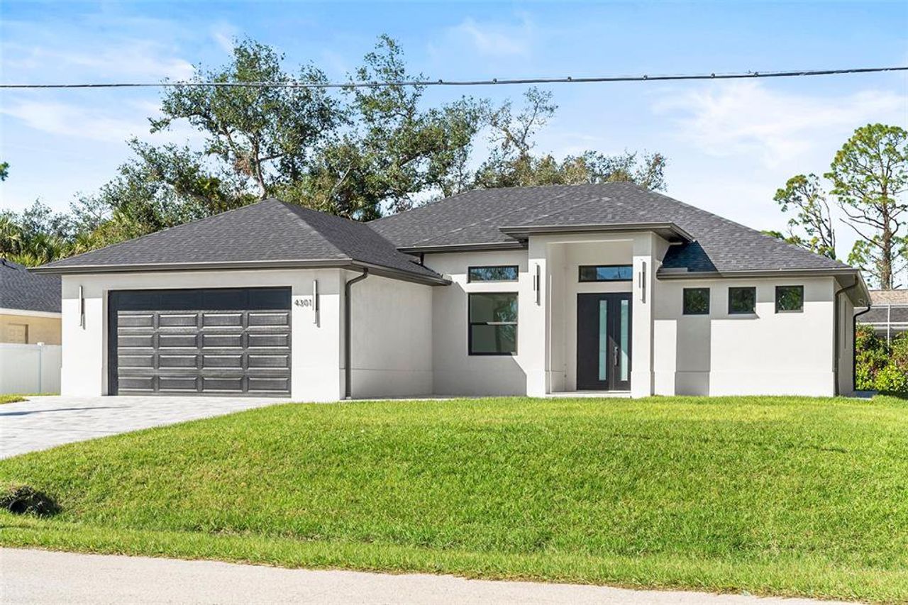 Front exterior of a new home in , North Port, FL, highlighting curb appeal (Image 2).