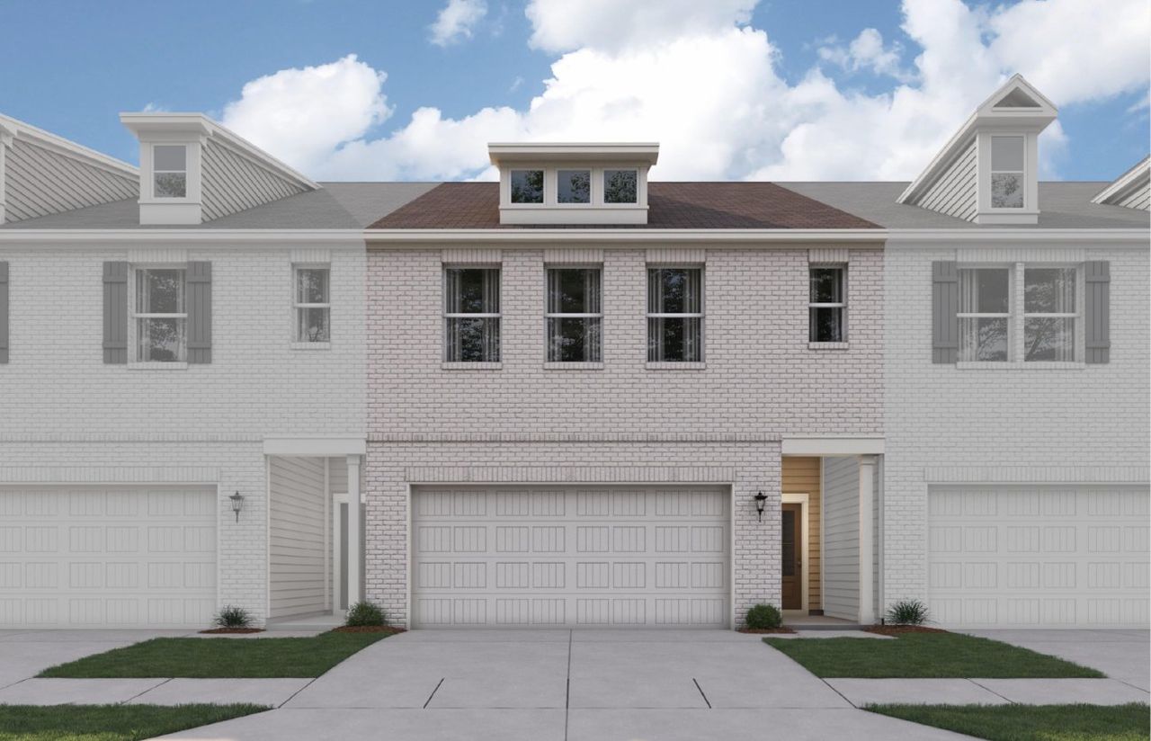 A white house with a garage.