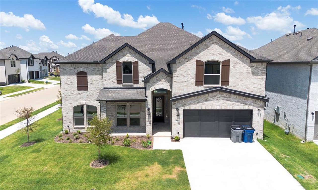 Front exterior of a new home in , Little Elm, TX, highlighting curb appeal (Image 2).