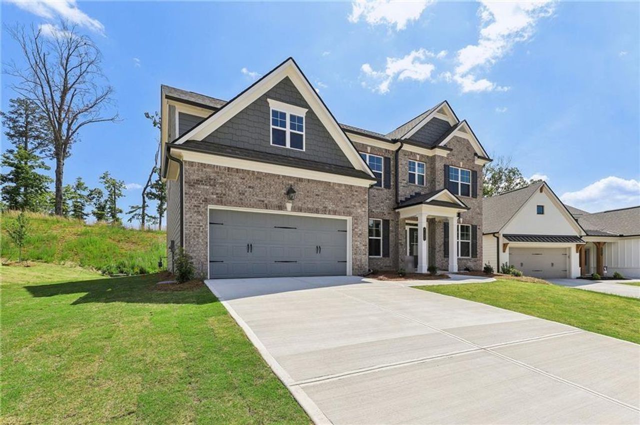 Front exterior of a new home in Overlook at Marina Bay, Gainesville, GA, highlighting curb appeal (Image 2).