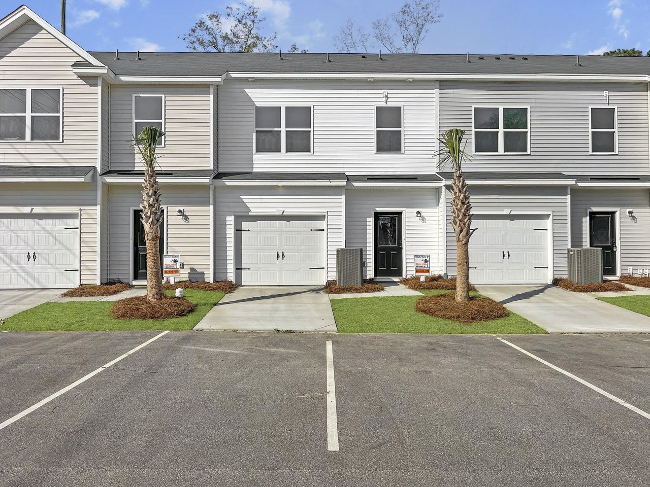 Front exterior of a new home in Garbon Townhomes, Summerville, SC, highlighting curb appeal (Image 2).