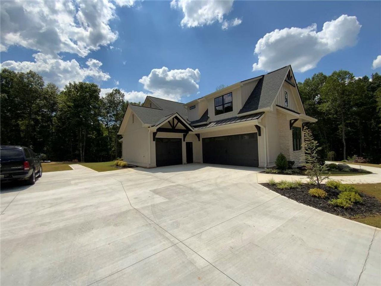 Front exterior of a new home in , Conyers, GA, highlighting curb appeal (Image 2). Front exterior of a new home in , Conyers, GA, highlighting curb appeal (Image 2).