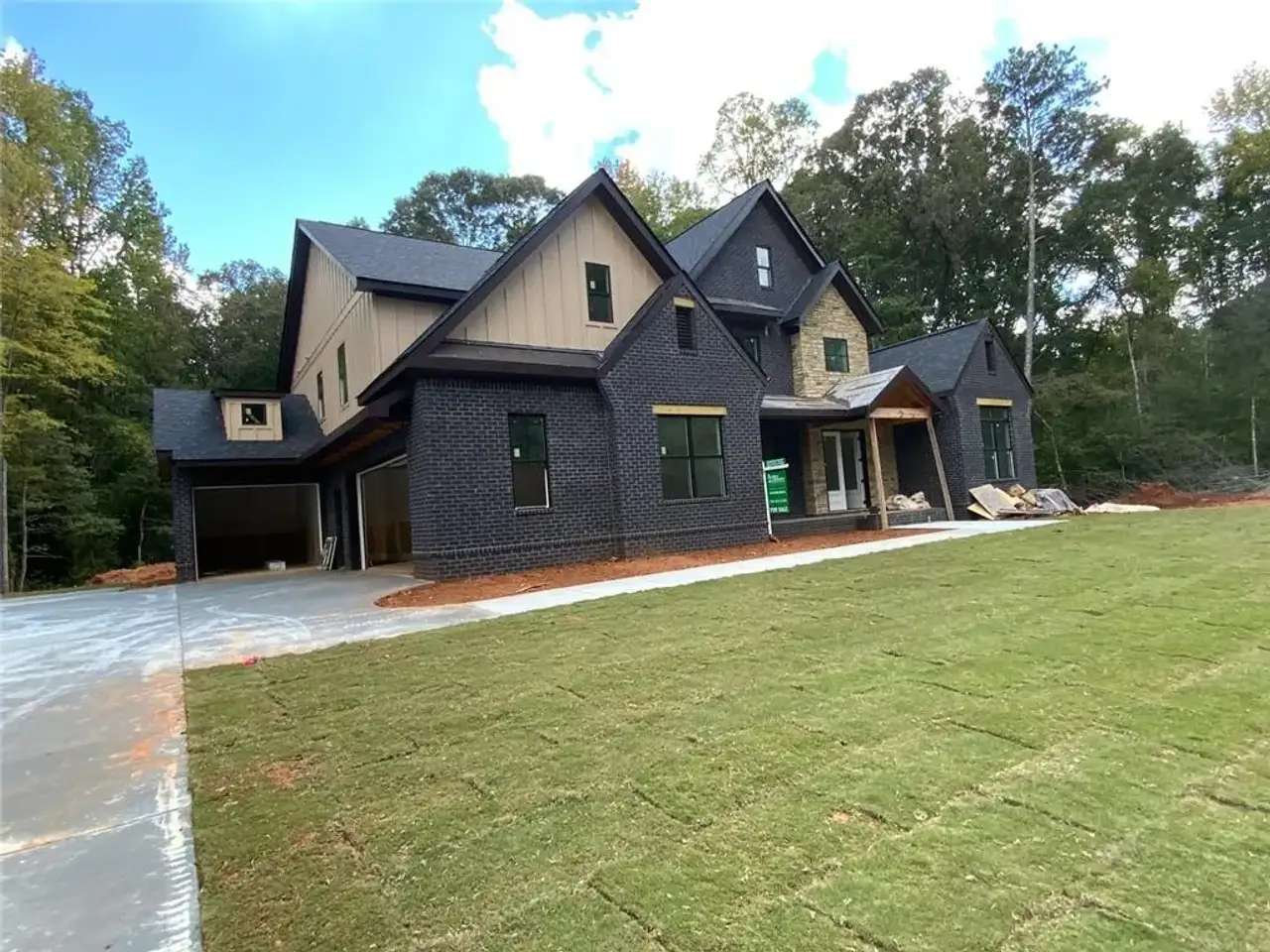 Front exterior of a new home in , Conyers, GA, highlighting curb appeal (Image 2). Front exterior of a new home in , Conyers, GA, highlighting curb appeal (Image 2).