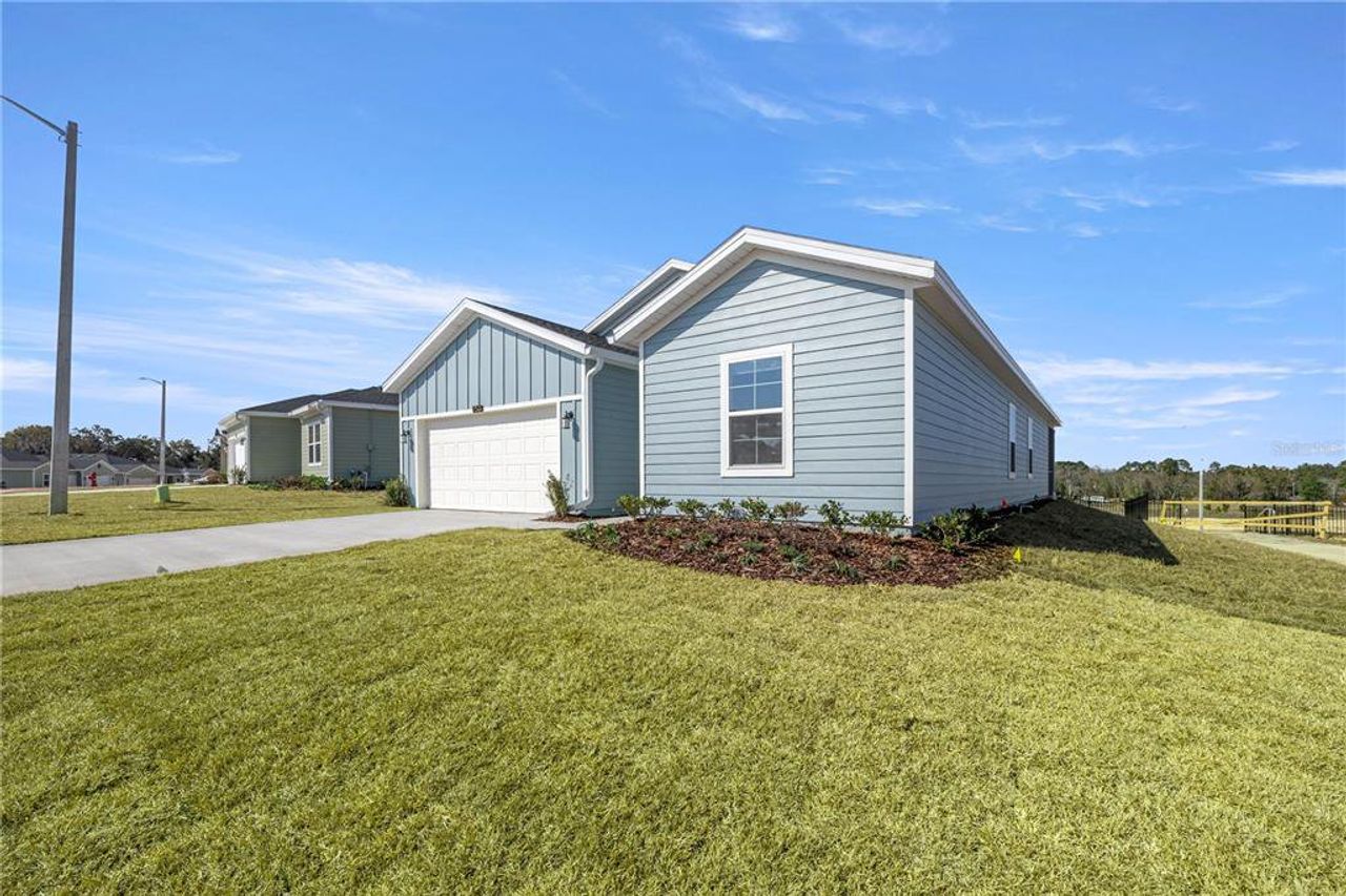 Front exterior of a new home in Pioneer Ranch, Ocala, FL, highlighting curb appeal (Image 2).