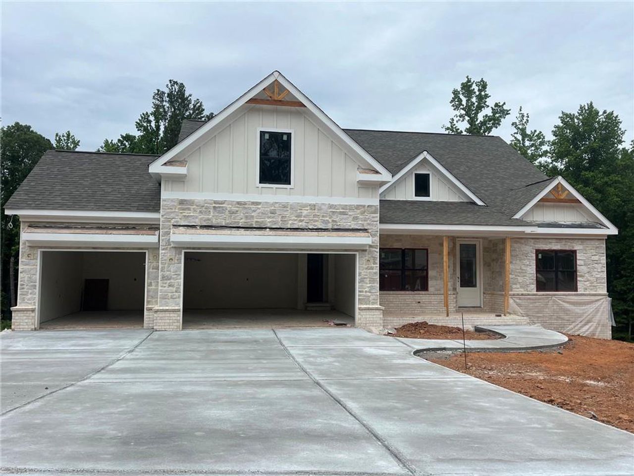 Front exterior of a new home in , Cumming, GA, highlighting curb appeal (Image 2). Front exterior of a new home in , Cumming, GA, highlighting curb appeal (Image 2).