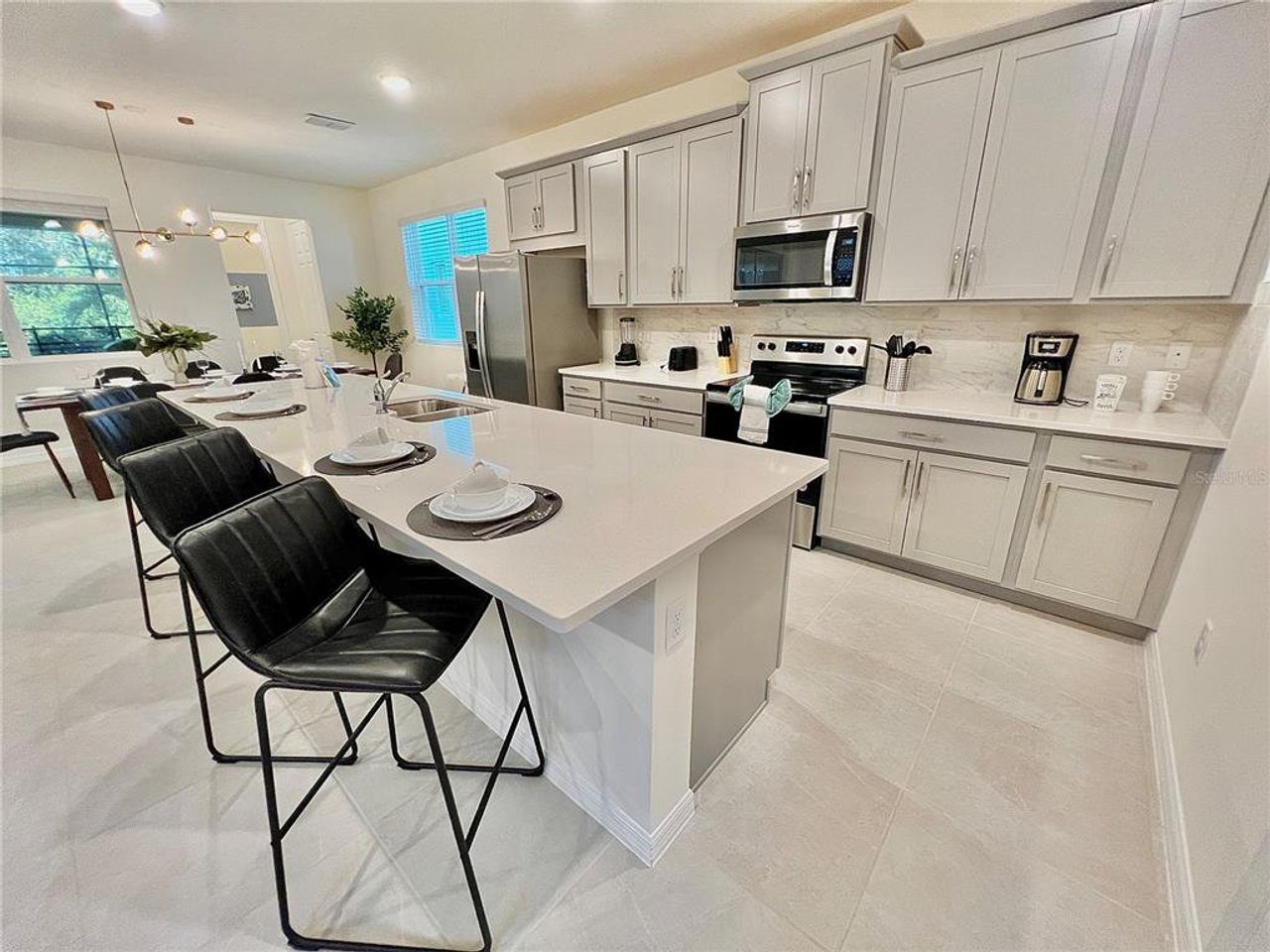 Furnished interior view inside a new home in Solara Resort, Kissimmee (Image 2).