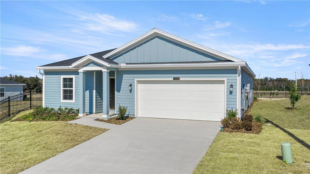 Front exterior of a new home in Trailhead Landing, Alachua, FL, highlighting curb appeal (Image 2). Front exterior of a new home in Trailhead Landing, Alachua, FL, highlighting curb appeal (Image 2).
