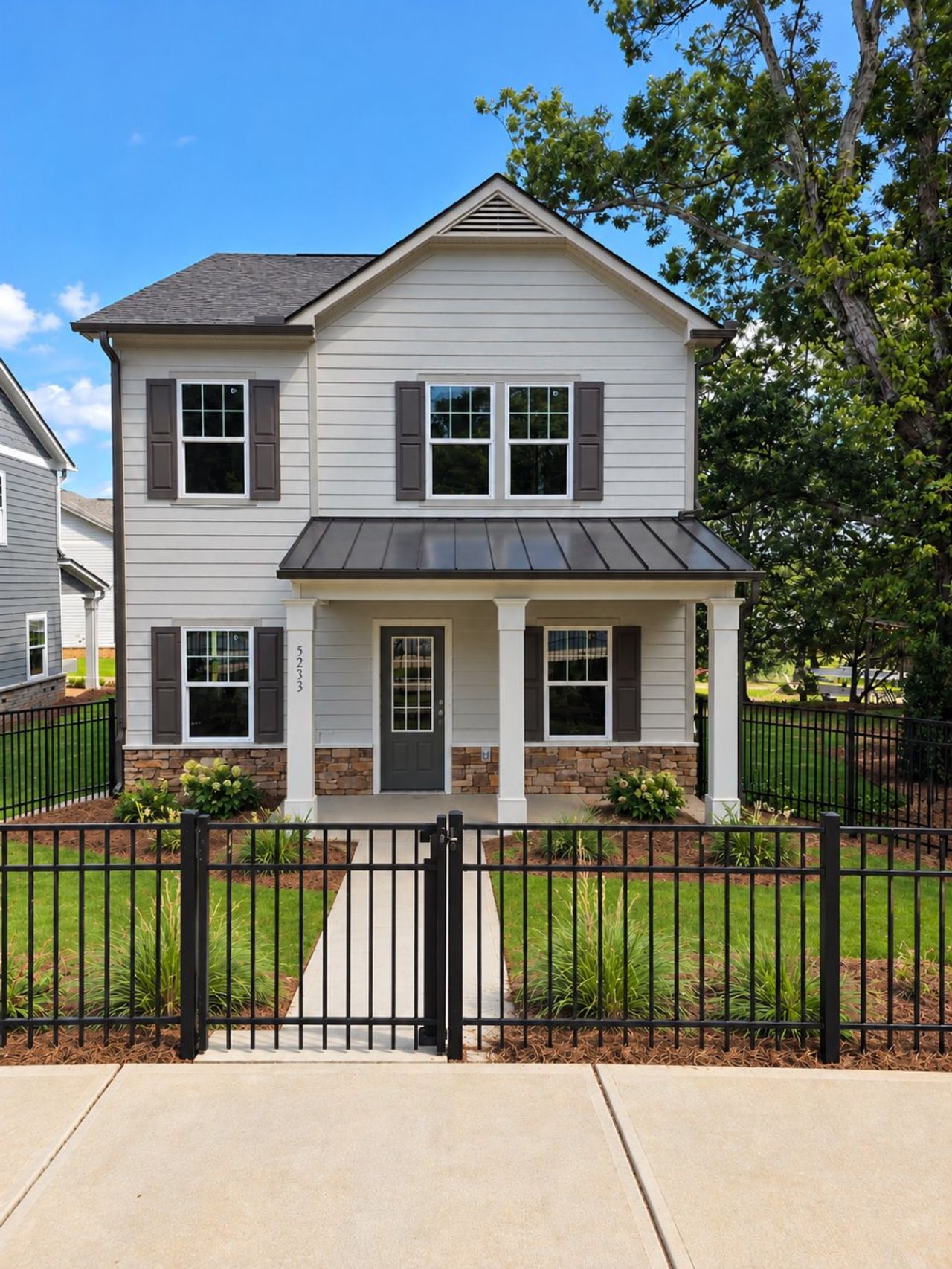 Front exterior of a new home in Magnolia Trace, Flowery Branch, GA, highlighting curb appeal (Image 2).