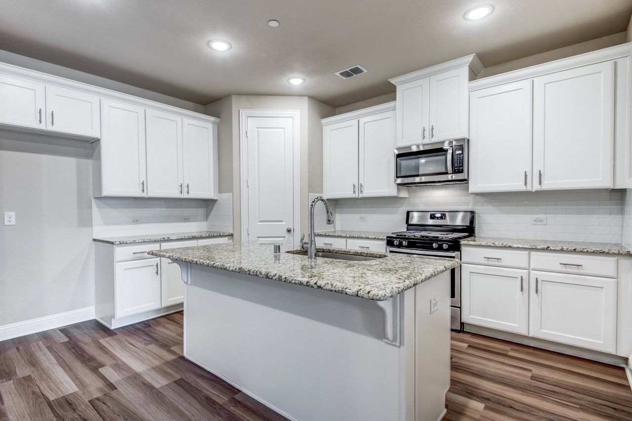 Representative furnished interior of a home built from the Shannon - INT by Megatel Homes in Founder's Parc, Euless (Image 2). Representative furnished interior of a home built from the Shannon - INT by Megatel Homes in Founder's Parc, Euless (Image 2).