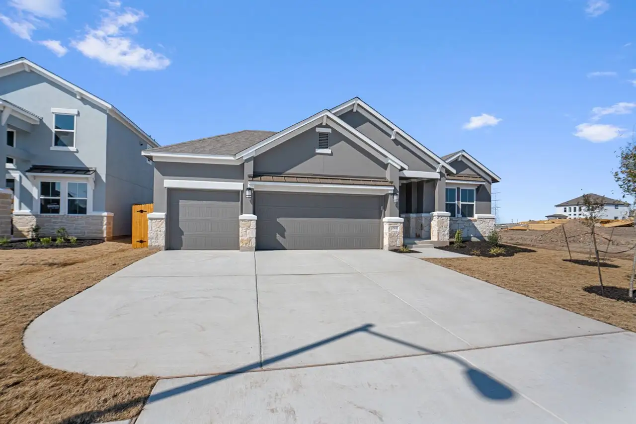 Representative exterior photo of a completed home built from the Palmer 1860 S 3CG by Saratoga Homes in Enclave at Cele, Pflugerville, TX (Image 2).