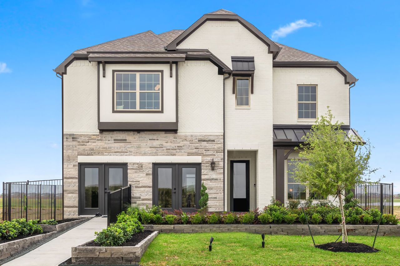 Front exterior of a new home in Lago Mar, Texas City, TX, highlighting curb appeal (Image 2). Front exterior of a new home in Lago Mar, Texas City, TX, highlighting curb appeal (Image 2).