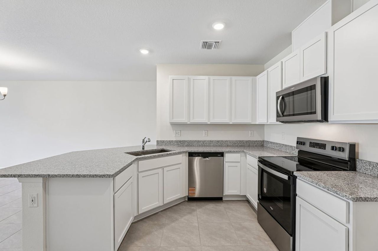 Furnished interior view inside a new home in Reserve at Forest Lake Townhomes, Lake Wales (Image 2).