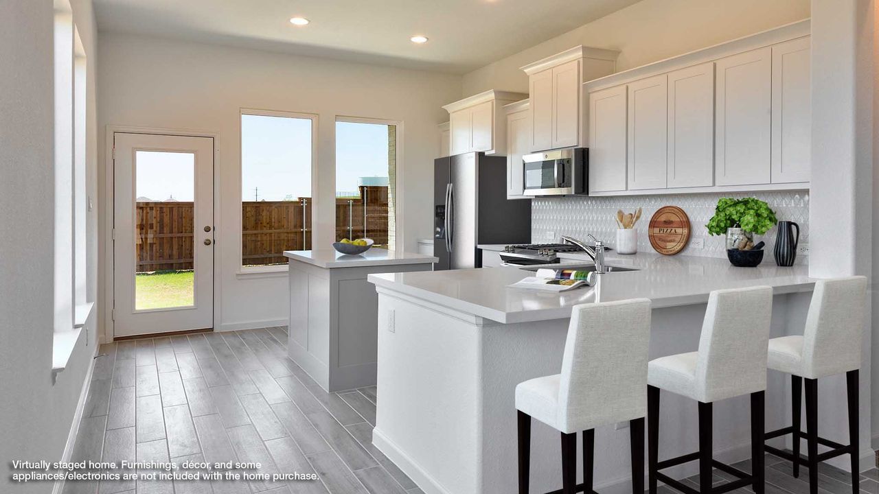 Furnished interior view inside a new home in Meridiana, Manvel (Image 2).