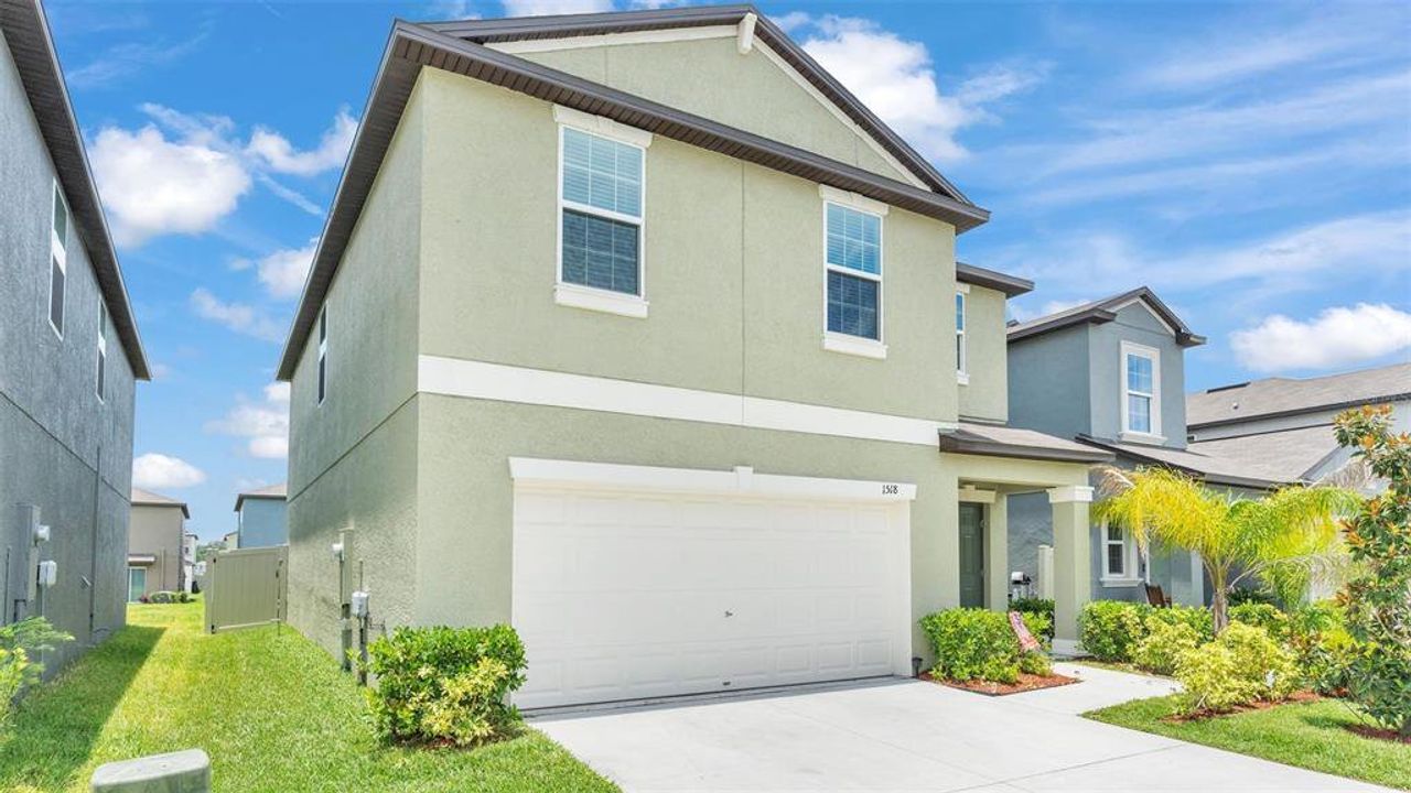 Front exterior of a new home in , Lakeland, FL, highlighting curb appeal (Image 2). Front exterior of a new home in , Lakeland, FL, highlighting curb appeal (Image 2).