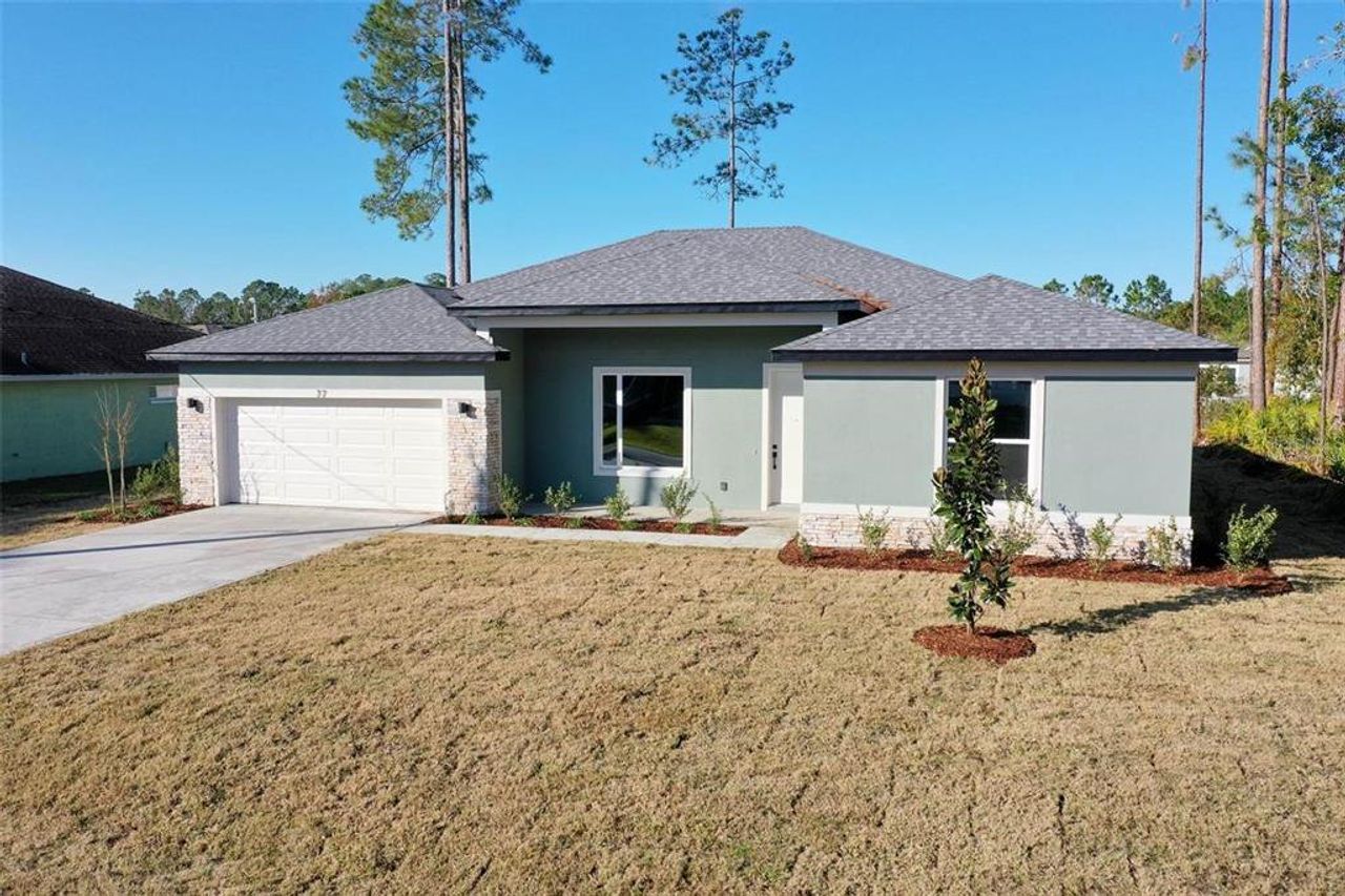 Front exterior of a new home in , Palm Coast, FL, highlighting curb appeal (Image 2).
