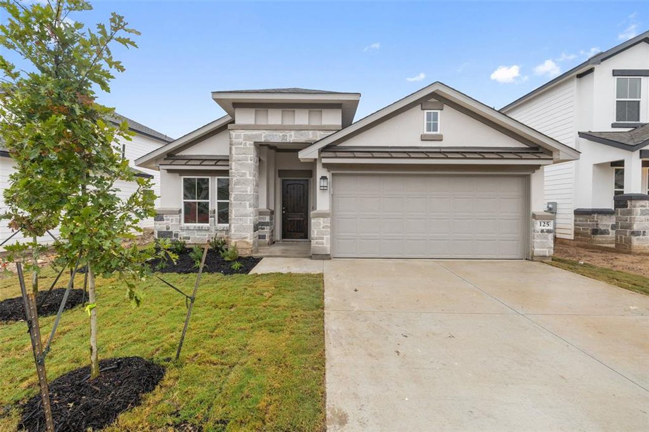 Front exterior of a new home in Lakeside at Tessera on Lake Travis, Meadowlakes, TX, highlighting curb appeal (Image 2).