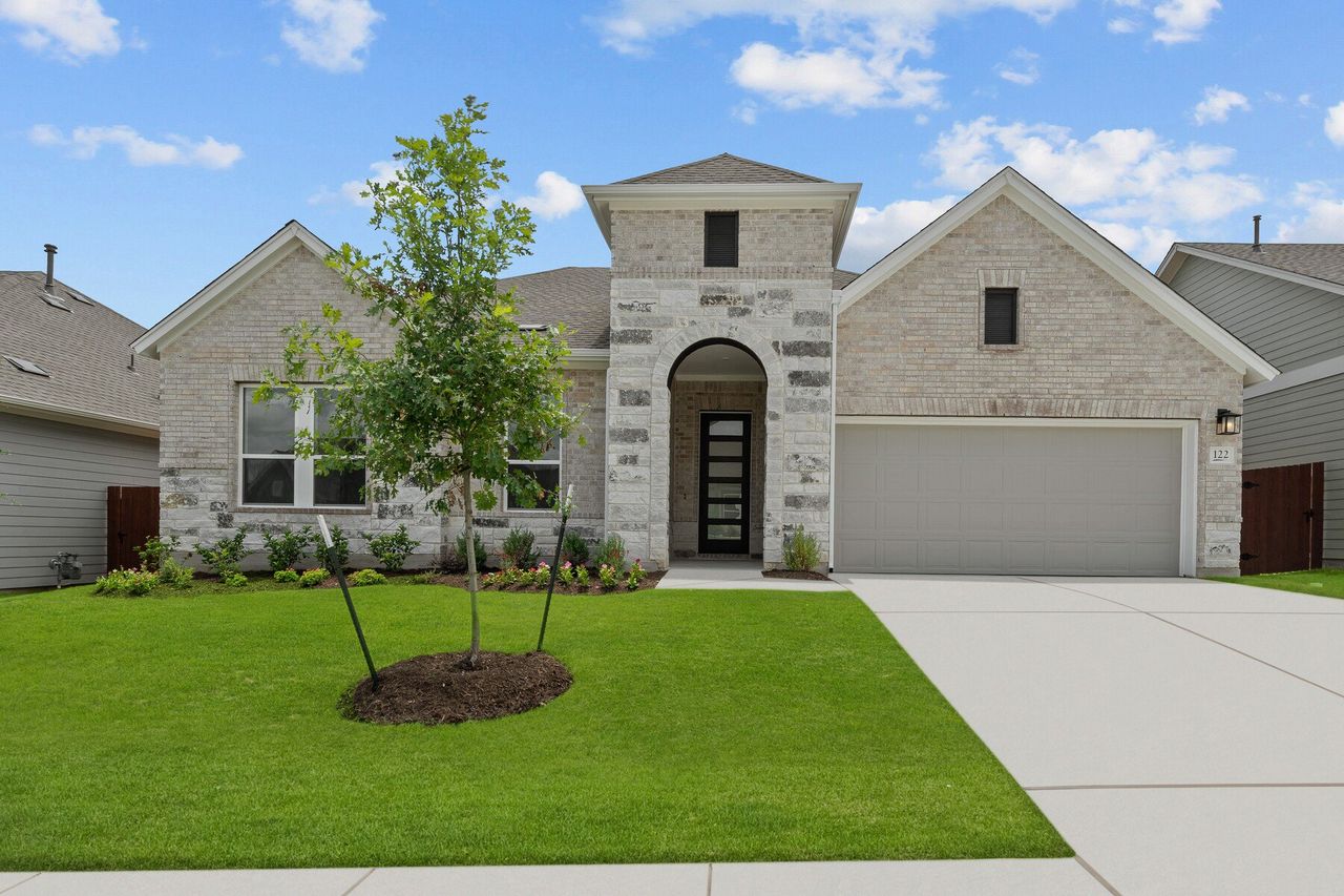 Representative exterior photo of a completed home built from the The Carrington by David Weekley Homes in Sunfield, Buda, TX (Image 2). Representative exterior photo of a completed home built from the The Carrington by David Weekley Homes in Sunfield, Buda, TX (Image 2).