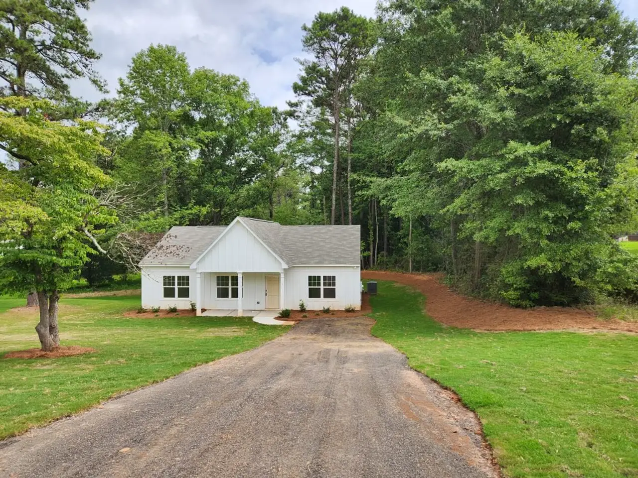 Front exterior of a new home in Clemit Harris Place, Newnan, GA, highlighting curb appeal (Image 2).