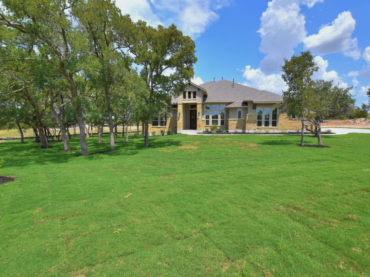 Representative exterior photo of a completed home built from the San Simeon II by Giddens Homes in Leander Estates, Leander, TX (Image 2).