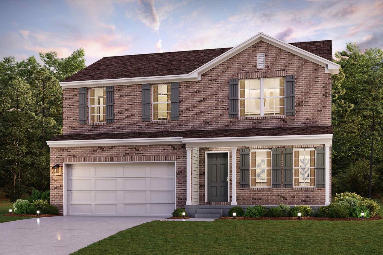 A large brick house with a garage.