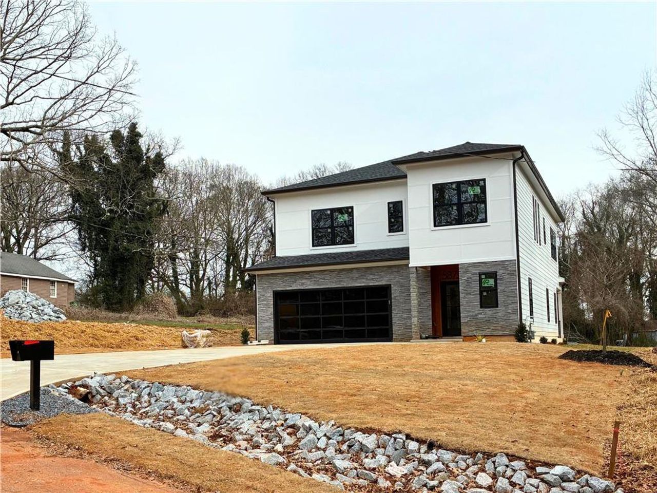 Front exterior of a new home in , Scottdale, GA, highlighting curb appeal (Image 2).