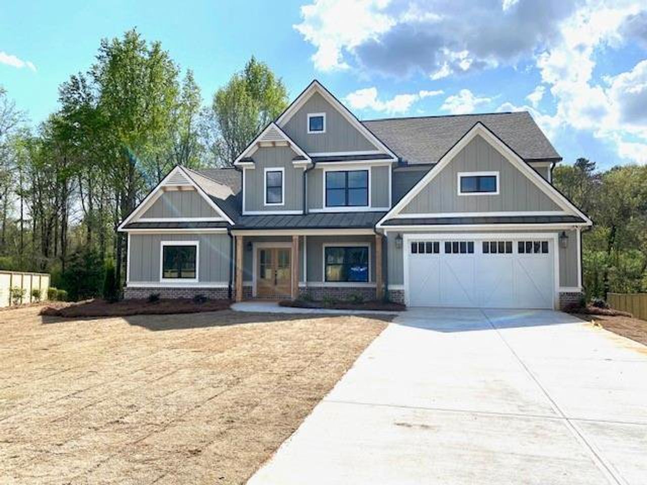Front exterior of a new home in Spring Creek, Monroe, GA, highlighting curb appeal (Image 2).