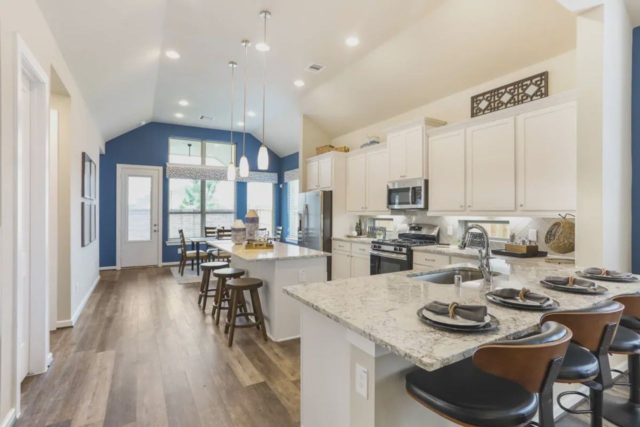 Representative furnished interior of a home built from the Medina by Chesmar Homes in Sienna Chateau, Missouri City (Image 2).