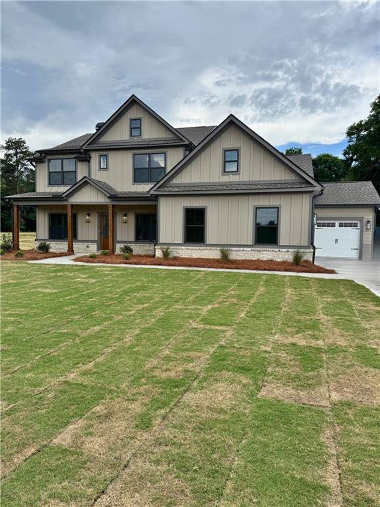 Front exterior of a new home in Youth Jersey Rd, Covington, GA, highlighting curb appeal (Image 2).